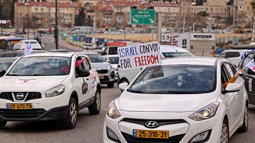 Israeli vehicles take part in a Canada-style protest convoy against Covid regulations in Jerusalem
