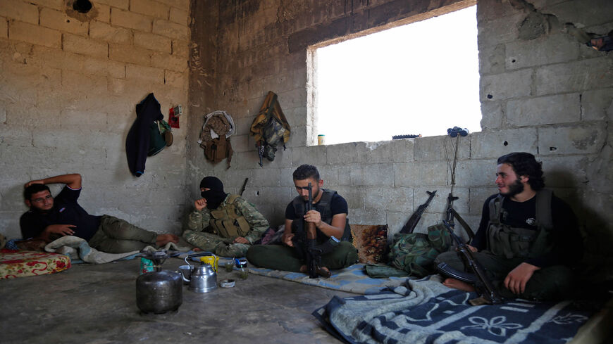 Syrian rebel fighters prepare in anticipation of an attack by the Bashar al-Assad regime on Idlib province and the surrounding countryside, in Kafr Zeta, Syria, Aug. 30, 2018.