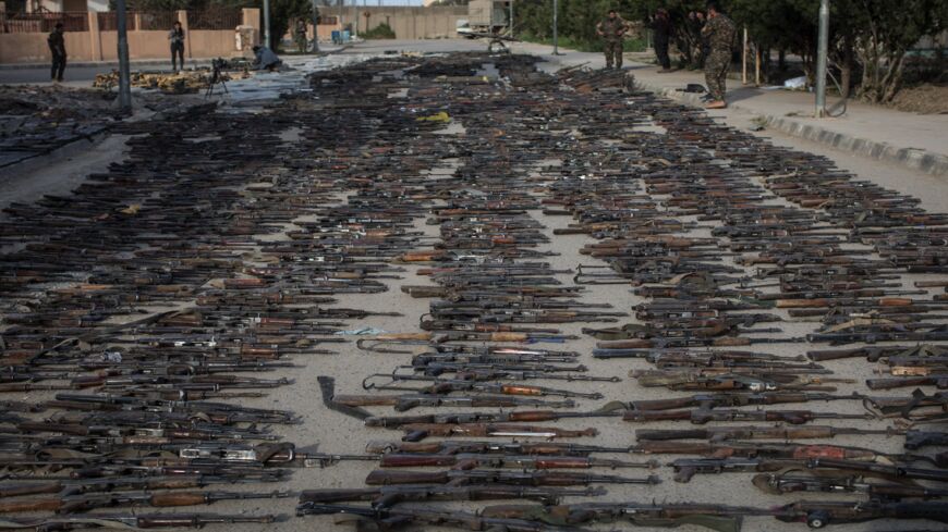 Seized Islamic State weapons found in the last stronghold of the extremist group are displayed on March 22, 2019, Al Mayadin, Syria. 