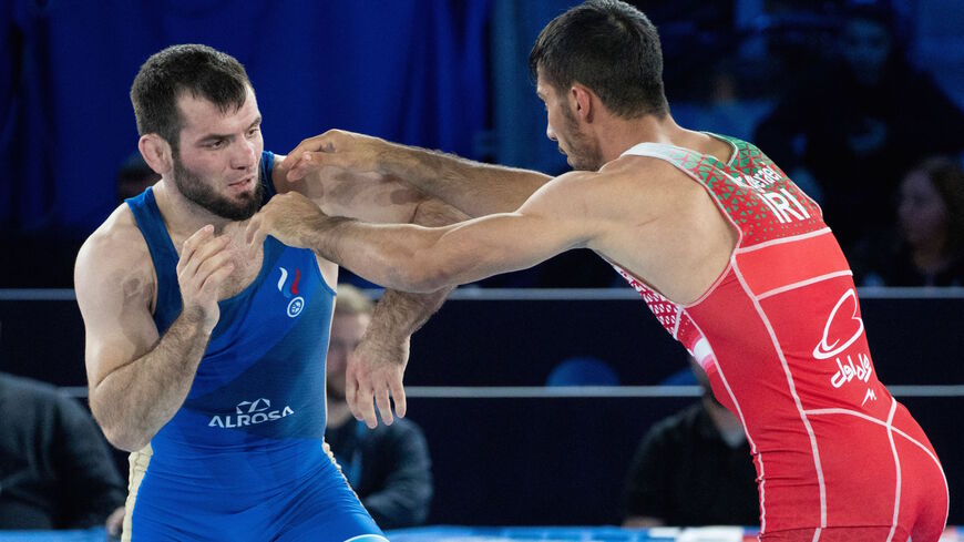 Iran's Mohammadreza Abdolhamid Geraei (R) fights against Russia's Nazir Rachidovitch Abdullaev in the 67 kg class final match of the Greco-Roman competition during the 2021 World Wrestling Championships in Oslo, Norway, on Oct. 10, 2021. 