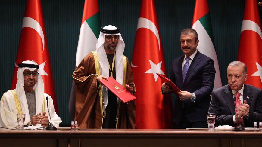 Turkish President Recep Tayyip Erdogan (R) and Abu Dhabi's Crown Prince Sheikh Mohammed bin Zayed Al Nahyan (L) attend a signing ceremony regarding the agreements between the two countries at the Presidential Complex in Ankara, on Nov. 24, 2021. 