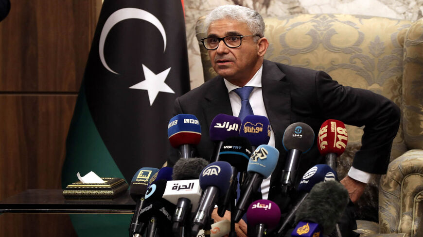 Libyan interim Prime Minister Fathi Bashagha, newly named by the Libyan parliament, delivers a speech at Mitiga International Airport, Tripoli, Libya, Feb. 10, 2022.