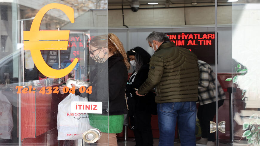 Customers stand at the counter of an exchange office, Ankara, Turkey, Feb. 23, 2022.