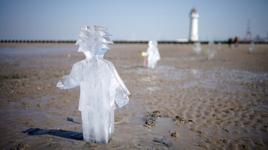 ice sculptures melt on beach