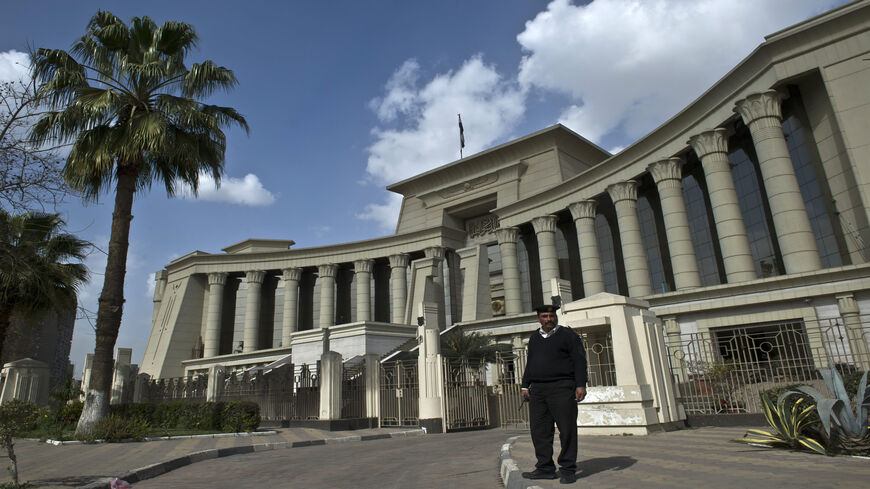 An Egyptian policeman stands guard outside the Supreme Constitutional Court, Cairo, Egypt, Feb. 25, 2015.