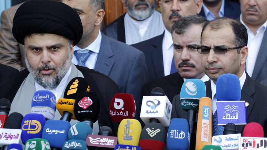 Iraqi Shiite cleric Muqtada al-Sadr speaks to the press after a meeting with parliament Speaker Salim al-Jabouri, alongside other Sunni parliament members, Najaf, Iraq, April 5, 2015.