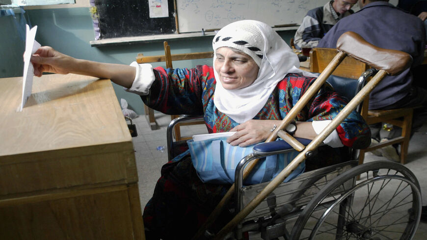 An Egyptian woman casts her vote at a polling station, Cairo, Egypt, Nov. 9, 2005.