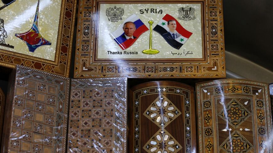 Souvenirs showing pictures of Syrian President Bashar al-Assad and Russian President Vladimir Putin in a Damascus shop illustrate the deep ties between the two allies, after Moscow intervened to shore up Assad in Syria's civil war