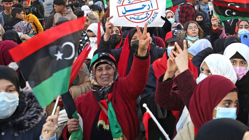 Libyans rally in Tripoli's iconic Martyrs' Square to mark the 11th anniversary of the uprising that toppled and killed veteran dicator Moamer Kadhafi
