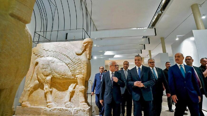 Iraqi Prime MinisterMustafa al-Kadhemi (C) inaugurates the renovated National Museum in Baghdad as it reopens following a 3-year closure