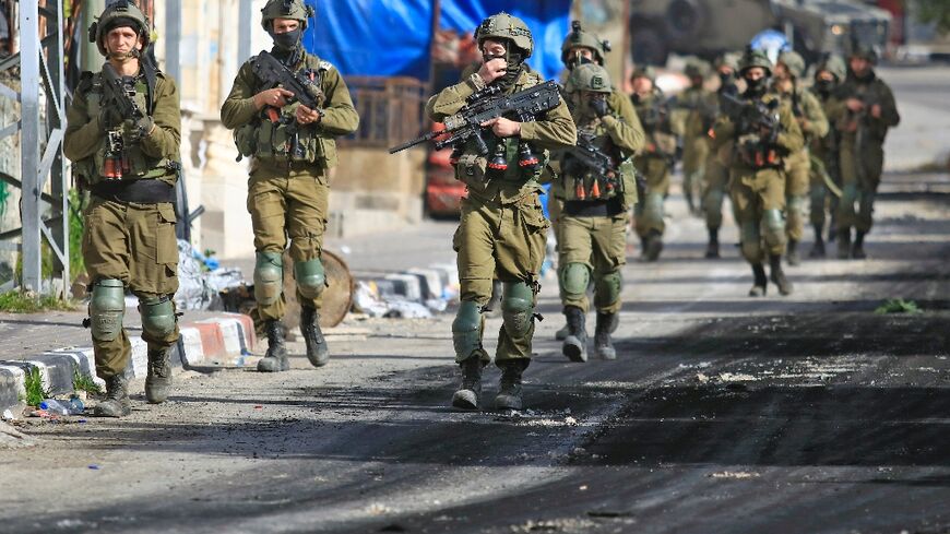Israeli soldiers patrol a village south of Jenin in the occupied West Bank
