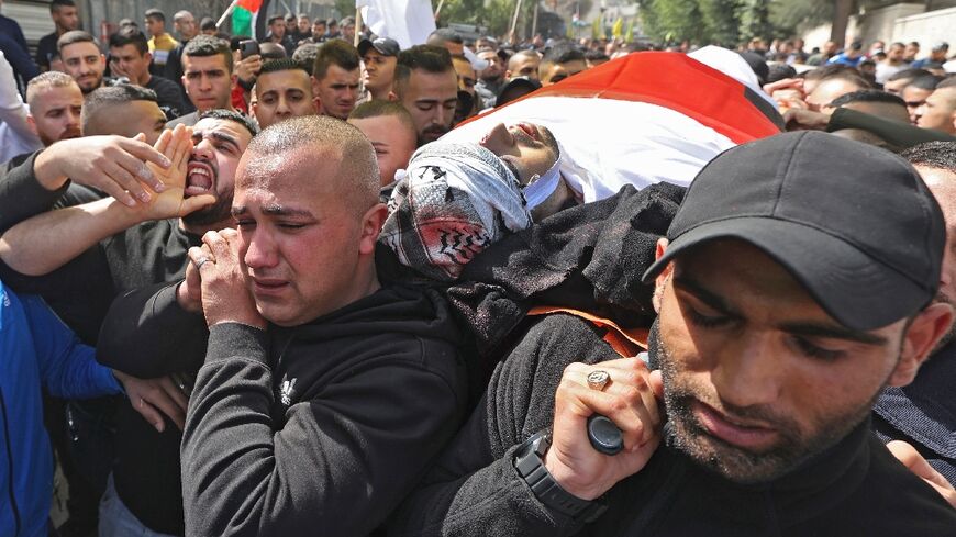 Palestinian mourners attend the funeral of one of the men killed during an Israeli raid in Jenin in the occupied West Bank