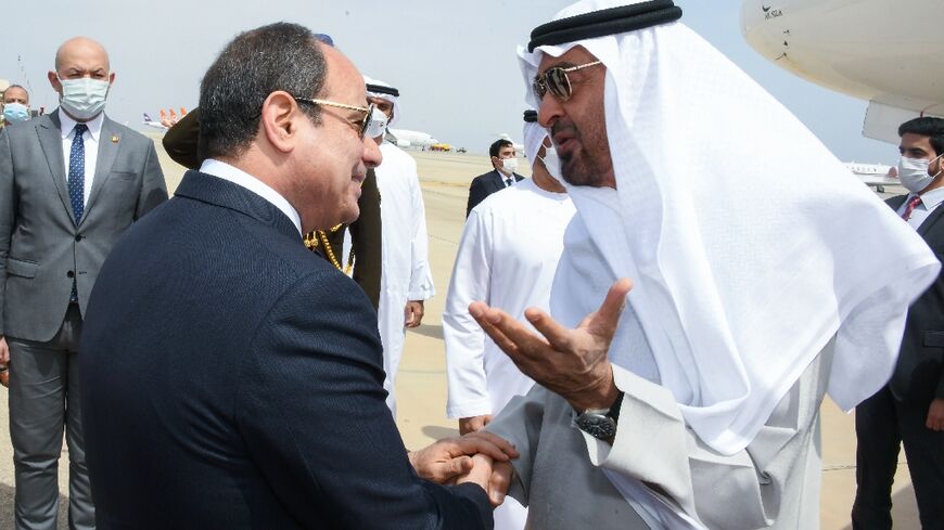 A handout picture released by the Egyptian Presidency on March 21, 2022 shows President Abdel Fattah al-Sisi (L) welcoming Crown Prince of Abu Dhabi Mohammed bin Zayed Al-Nahyan to Sharm el-Sheikh for talks