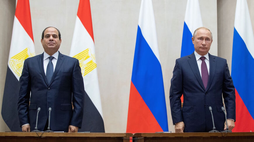 Russian President Vladimir Putin (R) and Egyptian President Abdel-Fattah el-Sisi pause during a minute of silence to commemorate the victims of an explosion in a vocational college in Crimea, during their talks in Sochi on Oct. 17, 2018. 