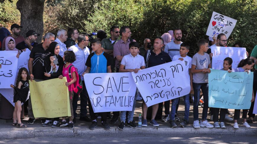 Demonstrators gather to protest outside the Israeli Knesset.