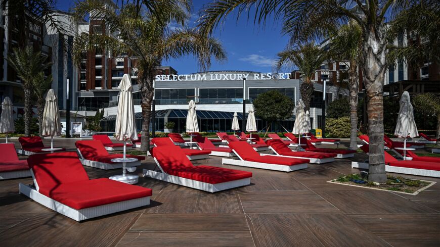 Prepared sunbeds sit empty at a luxury hotel on March 9, 2022, in Antalya, Turkey. 