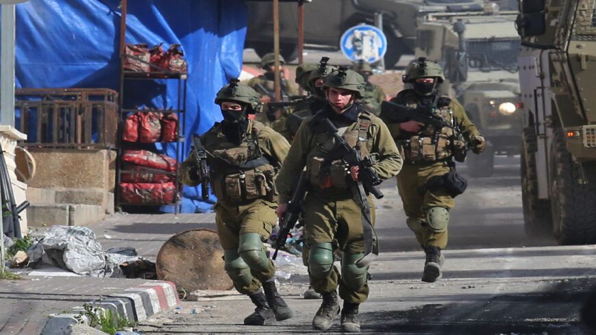 Israeli soldiers patrol on March 30, 2022.
