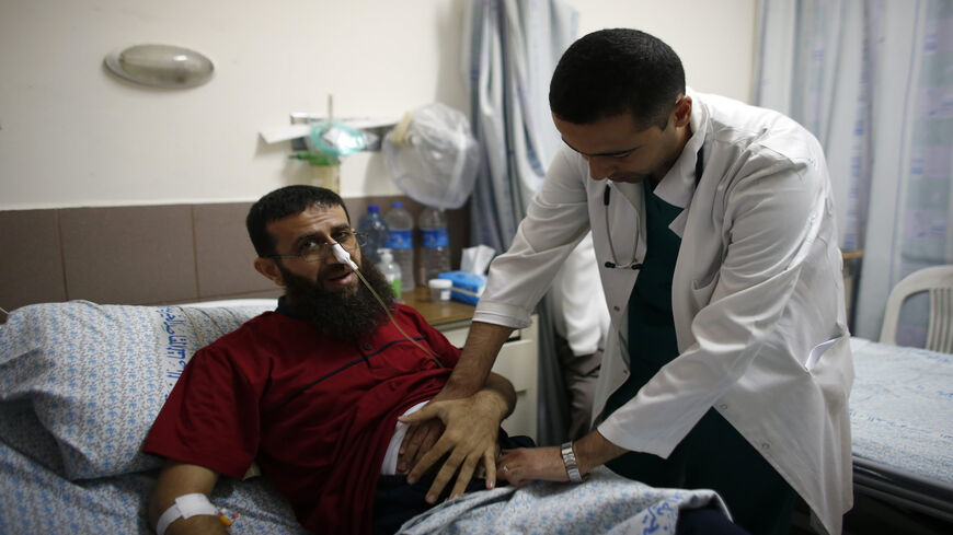 Palestinian Khader Adnan, who staged a 56-day hunger strike while being detained for a year without charge by Israeli authorities and who Israel says is a member of Islamic Jihad, lies on a bed as he is treated at the Makassed hospital in East Jerusalem, July 15, 2015.