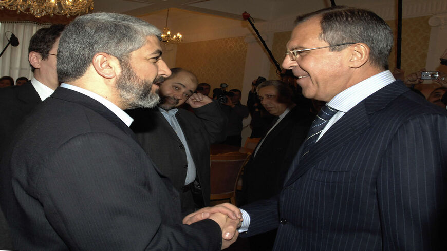 Russian Foreign Minister Sergey Lavrov (R) shakes hands with Hamas political director Khaled Meshaal before their meeting, Moscow, Russia, Feb. 27, 2007.