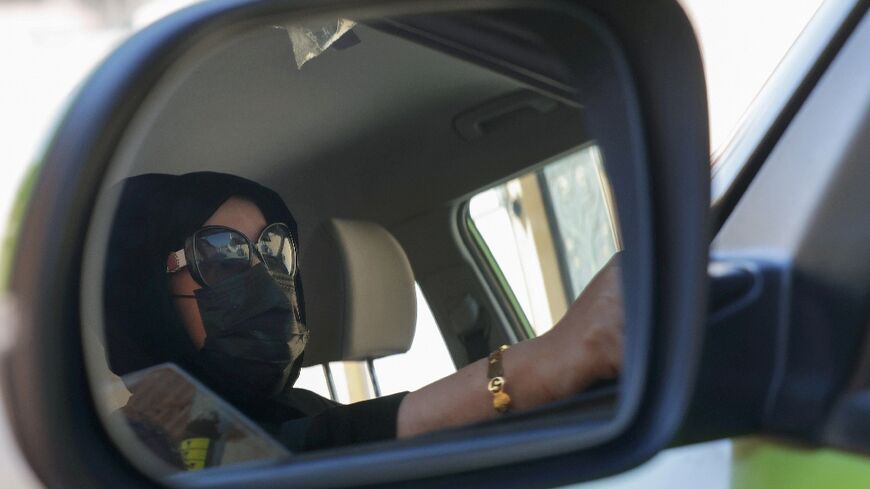 Fahda Fahd picks up fares in the Saudi capital Riyadh from a ride-hailing app exclusively for women, as a way of earning extra cash amid rising living costs in the kingdom