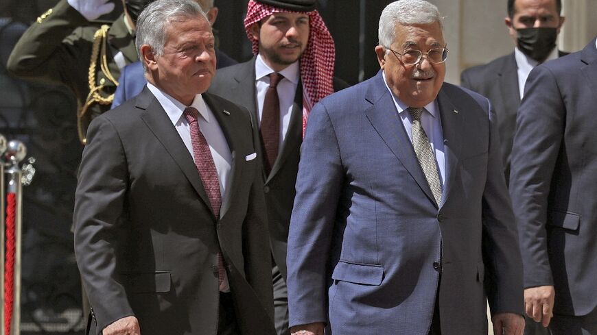 Palestinian president Mahmud Abbas, on the right, welcomes King Abdullah II of Jordan, accompanied by Crown Prince Hussein behind them, in Ramallah in the occupied West Bank, on March 28, 2022