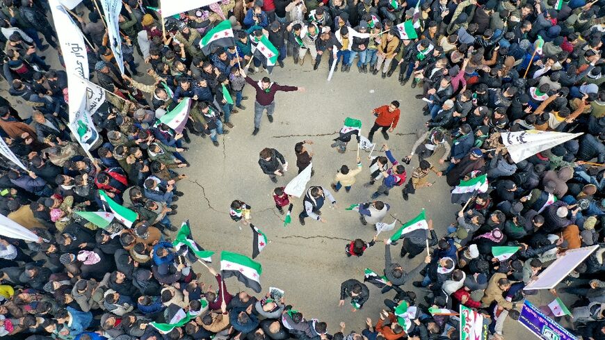 More than 5,000 Syrians gather in the rebel-held city of Idlib to mark the 11th anniversary of their uprising