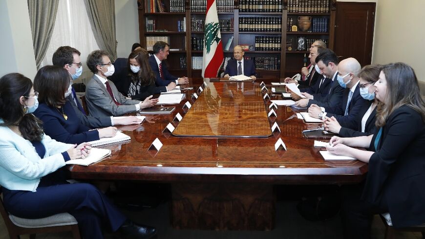 Lebanon's President Michel Aoun meets the International Monetary Fund (IMF) delegion at the presidential palace in Baabda, east of the capital Beirut, on March 30, 2022