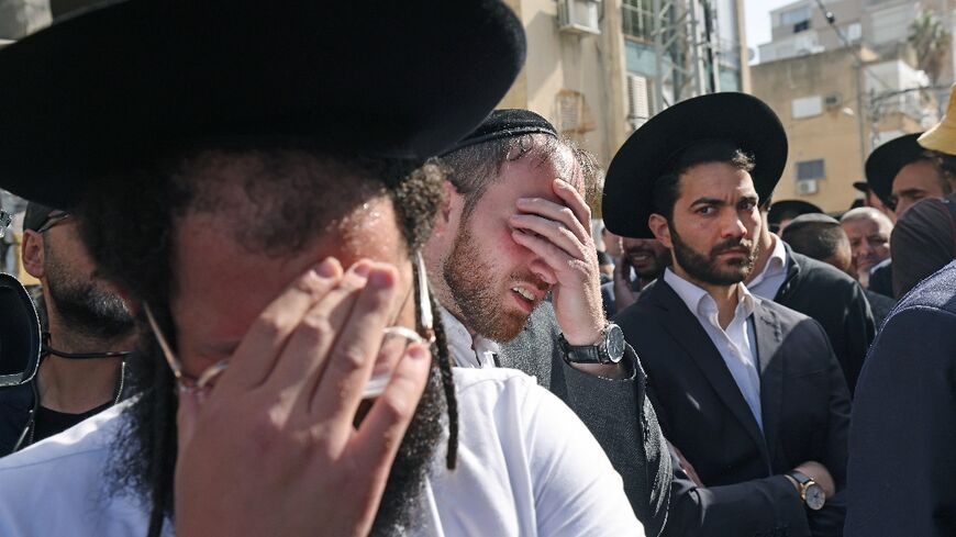 Israeli mourners attend the funeral of Avishai Yehezkel, one of the five people killed in Tuesday's shooting rampage