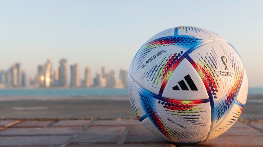 The ball for the 2022 World Cup with the Doha skyline in the background. The Qatari capital hosts the draw for the tournament on Friday