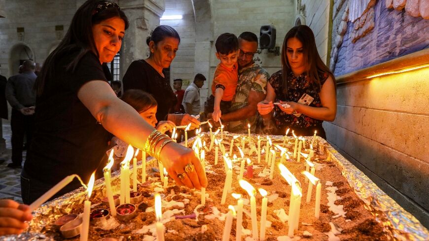 Iraqi Orthodox Christians celebrate Easter at the church of the ancient Mor Mattai Monastery in the village of Bashiqa
