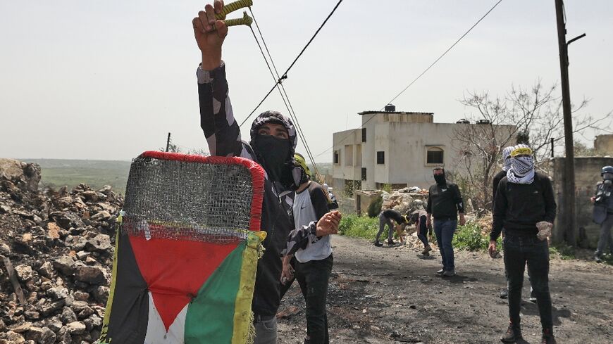 Palestinians demonstrating against the expropriation of land by Israel, clash with Israeli security forces in the village of Kfar Qaddum near the Jewish settlement of Kedumim in the occupied West Bank, on April 1