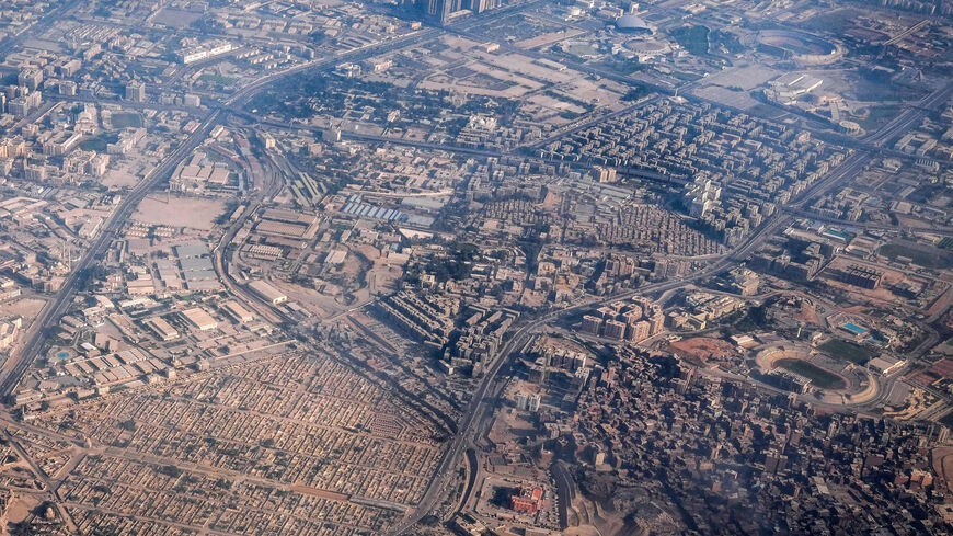 This aerial view shows the City of the Dead (bottom L), near the Darassa district, Cairo, Egypt, Jan. 15, 2021.