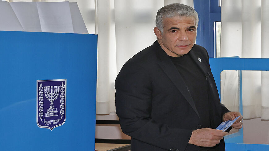 Israel's centrist former television anchor Yair Lapid, the prime minister's main challenger, votes at a polling station, in the fourth national election in two years, Tel Aviv, Israel, March 23, 2021.