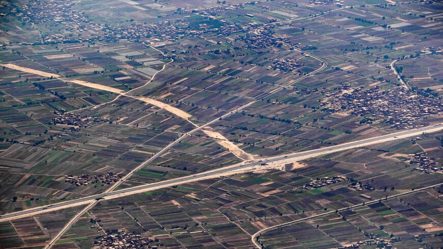 An aerial view shows a section of the new "Regional Ring Road" highway project, passing by the northern village of al-Naaminah in the fertile Nile Delta agricultural region in Sharqiyah province, Egypt, May 28, 2021.