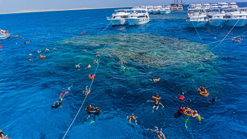 Local and foreign tourists snorkel in the Red Sea waters above a coral reef near Sharm el-Sheikh, at the southern tip of the Sinai Peninsula, Egypt, Sept. 29, 2021.