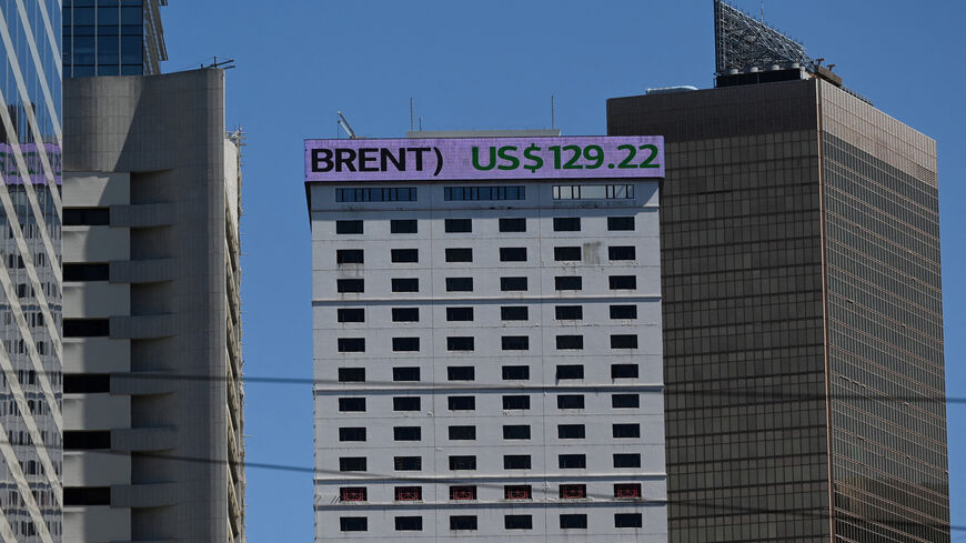 An electronic sign on a building shows the price of Brent crude oil in Hong Kong, March 9, 2022.