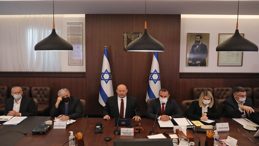 Israeli Prime Minister Naftali Bennett (C) attends a Cabinet meeting at the prime minister's office, Jerusalem, March 27, 2022.