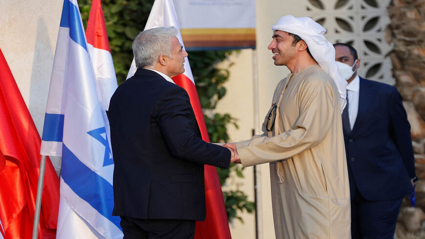 Israeli Foreign Minister Yair Lapid (L) welcomes the United Arab Emirates' Foreign Minister Sheikh Abdullah bin Zayed Al Nahyan upon his arrival for the Negev summit, at Sde Boker in the southern Negev desert, Israel, March 27, 2022.
