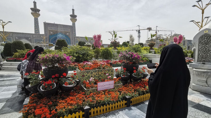 Iranians visit the spot in the courtyard of Imam Reza shrine in the northeastern city of Mashhad on April 6, 2022, where a day earlier a Muslim cleric was killed. 
