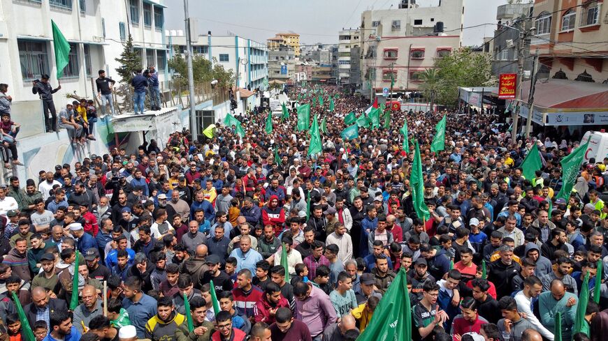 This aerial view shows supporters of the Palestinian Hamas movement rallying after Friday prayers, in Jabalia in the northern Gaza Strip, to show solidarity with Palestinians confronting Israeli forces at the AL-Aqsa Mosque compound in Jerusalem, on April 22, 2022.