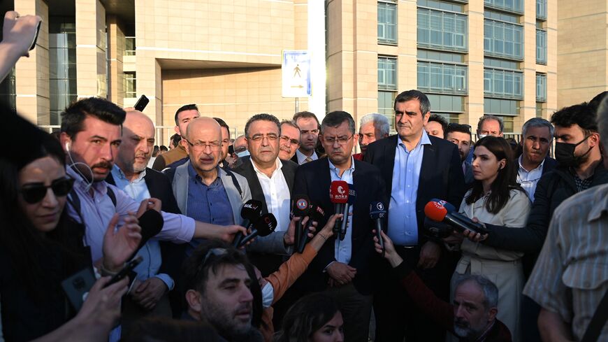 Opposition Republican People's Party (CHP) MPs Ali Seker (CR), Ozgulr Ozel (C) and Sezgin Tanrikulu (CL) speak to the press.