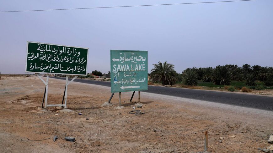 A street sign for Sawa Lake is seen in Iraq's southern province of al-Muthanna, on April 19, 2022. 
