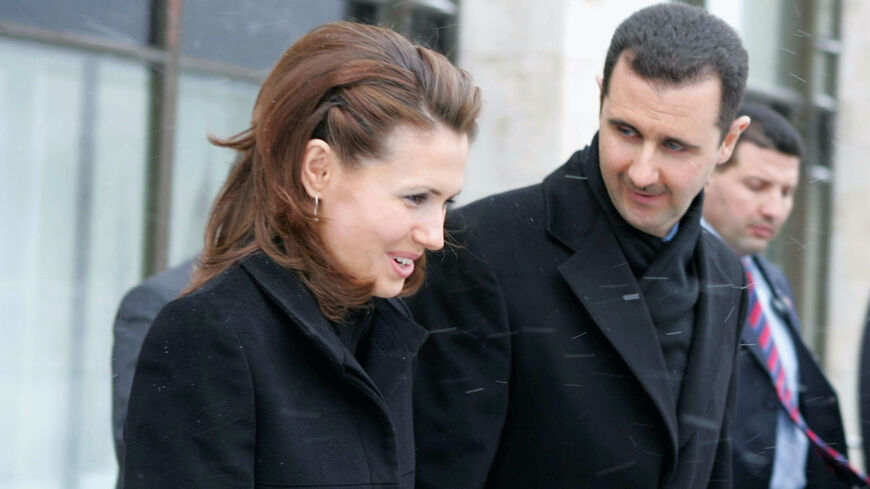 Syrian President Bashar Assad and his wife Asma Assad are seen during a visit to Moscow's State Institute for Foreign Relations on Jan. 25, 2005. Assad was awarded with a honorary doctorate. 