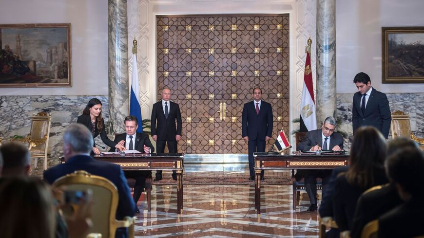Egyptian President Abdel Fattah al-Sisi (back-R) and his Russian counterpart, Vladimir Putin (back-L).