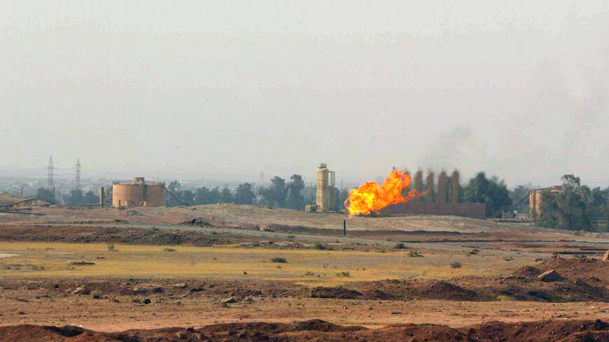A gas flare burns in a field close to the northern oil-rich city of Kirkuk, 225 kms from Baghdad on Nov. 2, 2009. 