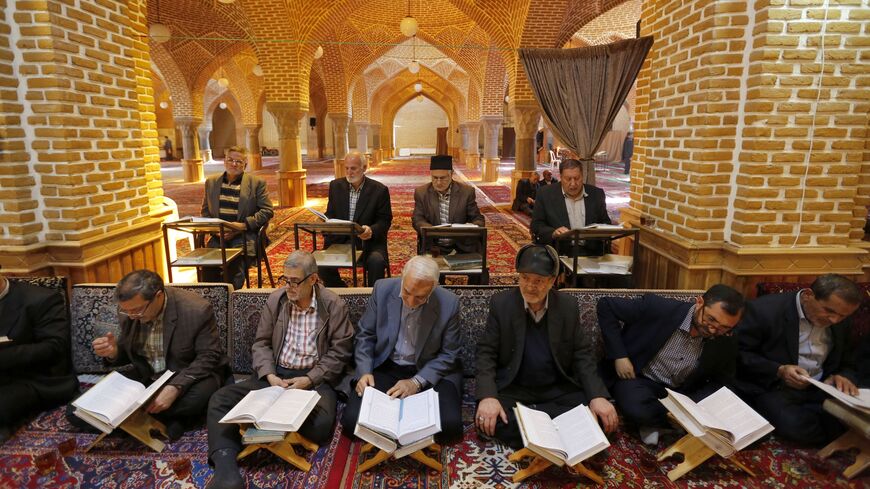 A picture taken on April 24, 2018, shows Iranians reading the Quran.