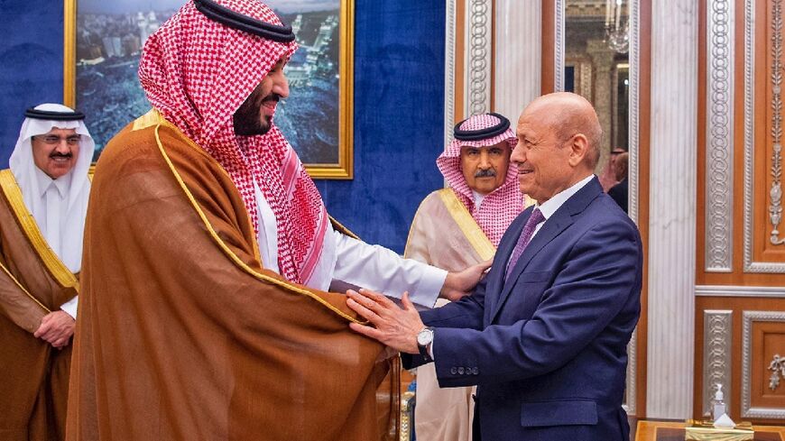 Saudi Crown Prince Mohammed bin Salman (L) shakes hands in Riyadh with Rashad al-Alimi, who will lead Yemen's new leadership council
