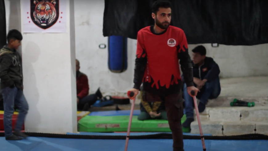 Fadel Othman inside a small gym in northern Syria where he teaches kung fu. 
