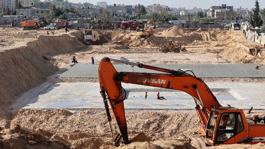 Egyptian diggers and earth movers work at the construction site of a new housing complex north of Gaza City. Egypt and Qatar have provided reconstruction aid to Gaza