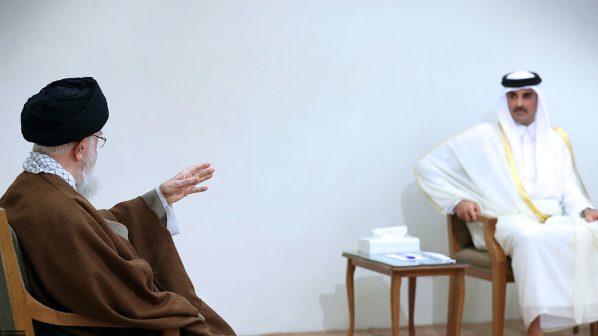 Supreme Leader Ayatollah Ali Khamenei speaks with Qatari Emir Sheikh Tamim bin Hamad Al Thani in Tehran, May 12, 2022.